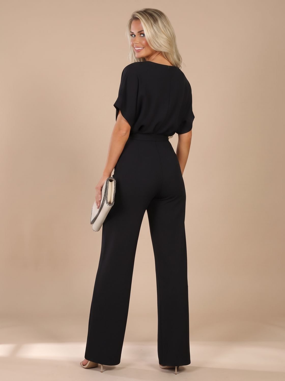 Damesjumpsuit met korte mouwen, strikceintuur en wijde pijpen