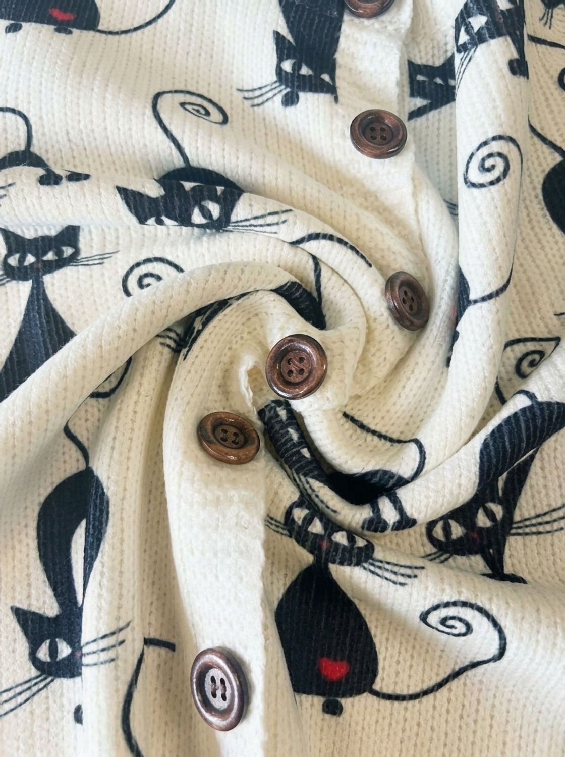Gebreid damesvest met bloemenprint, lange mouwen en knoopsluiting