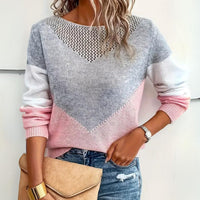 Gebreide damestrui met colourblock, mesh-detail en relaxte pasvorm