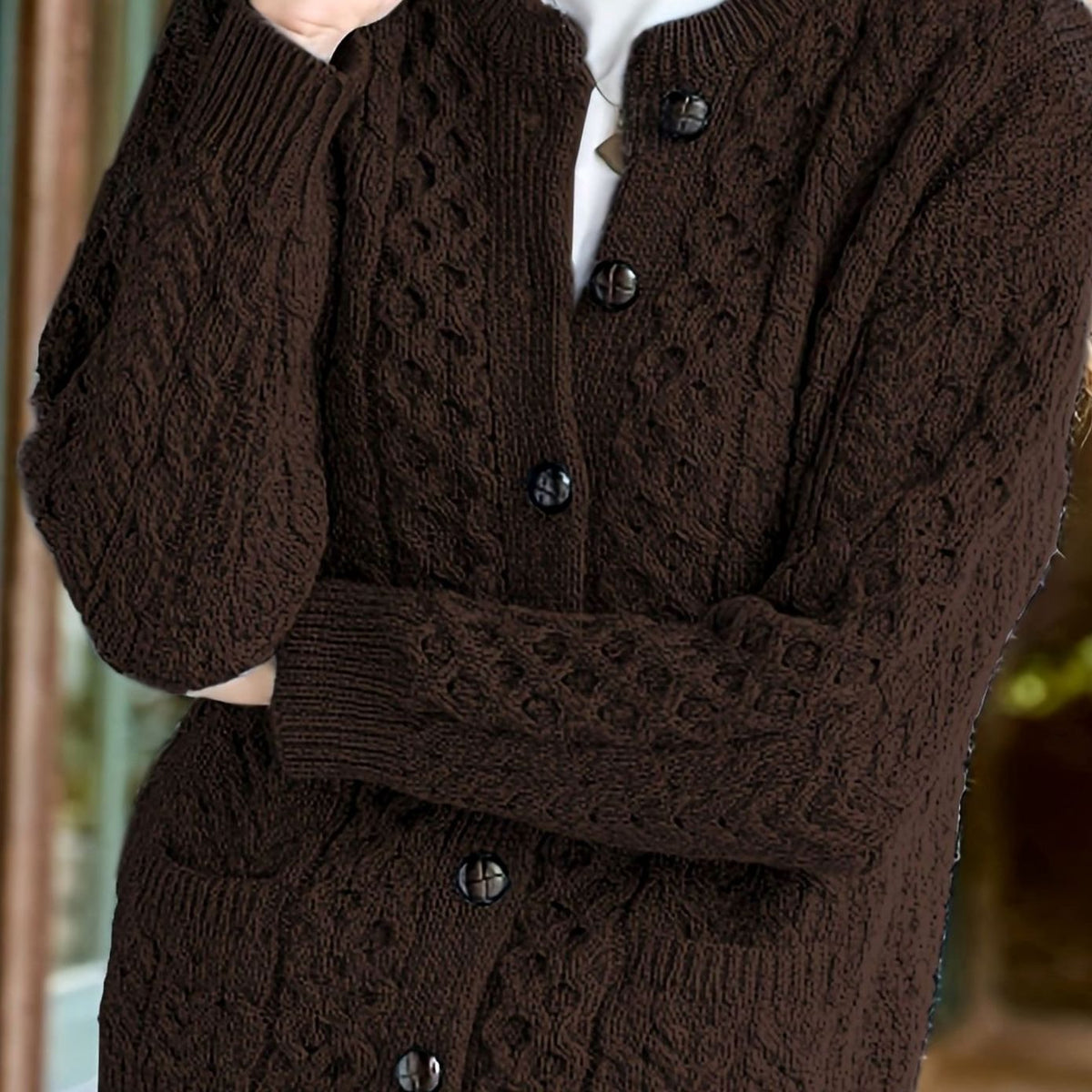Kabelgebreid relaxed vest met knoopsluiting voor dames