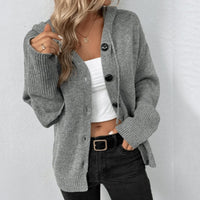 Oversized damesvest met capuchon en knoopsluiting