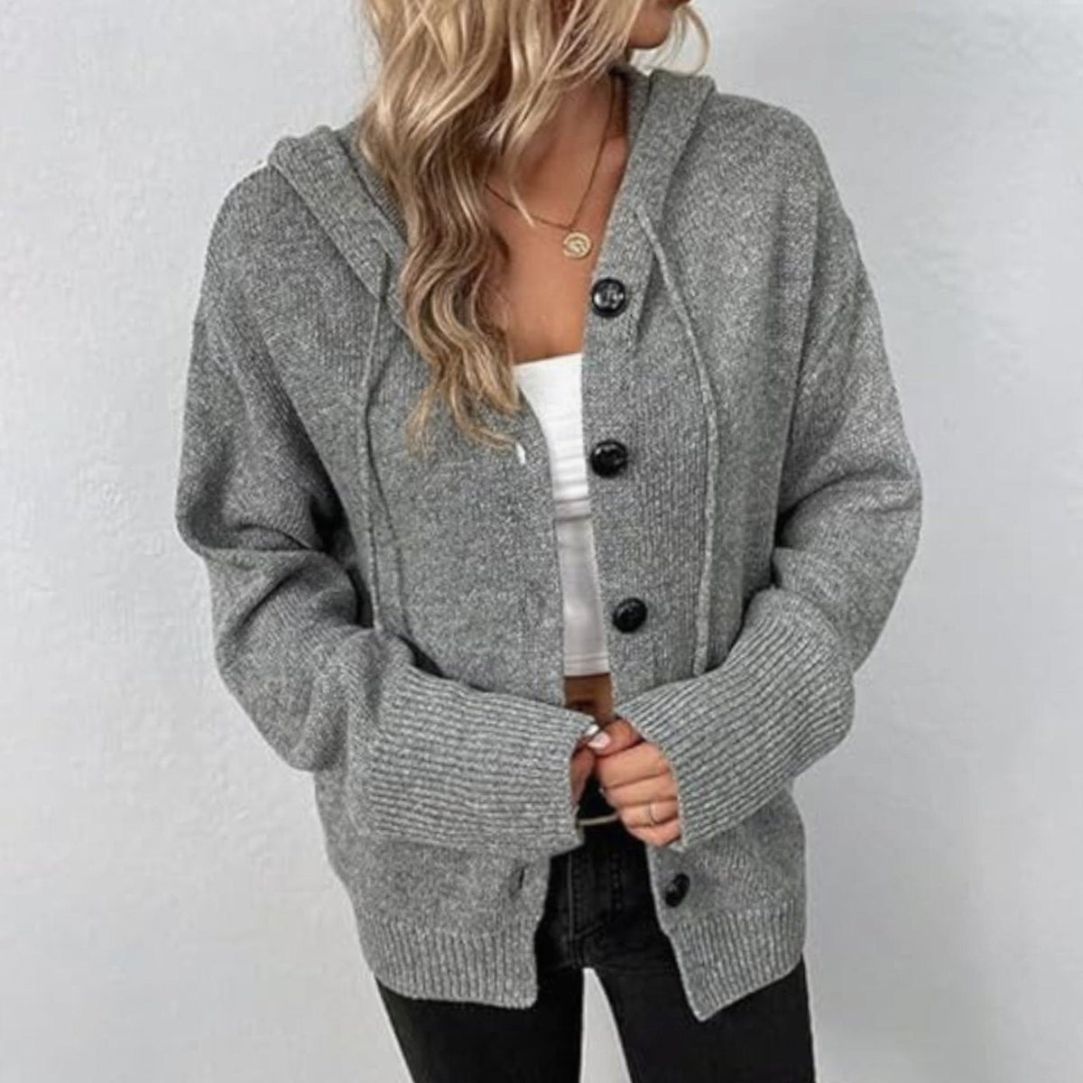 Oversized damesvest met capuchon en knoopsluiting