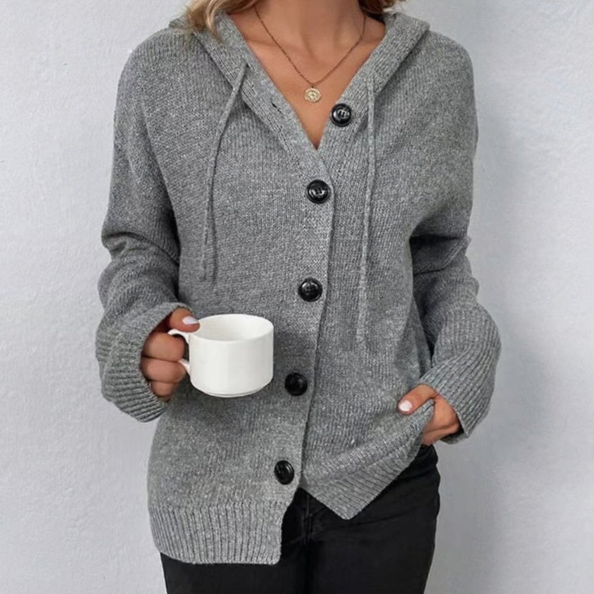 Oversized damesvest met capuchon en knoopsluiting