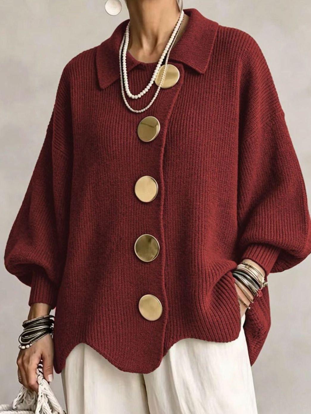 Oversized gebreid damesvest met gouden knopen en lantaarnmouwen