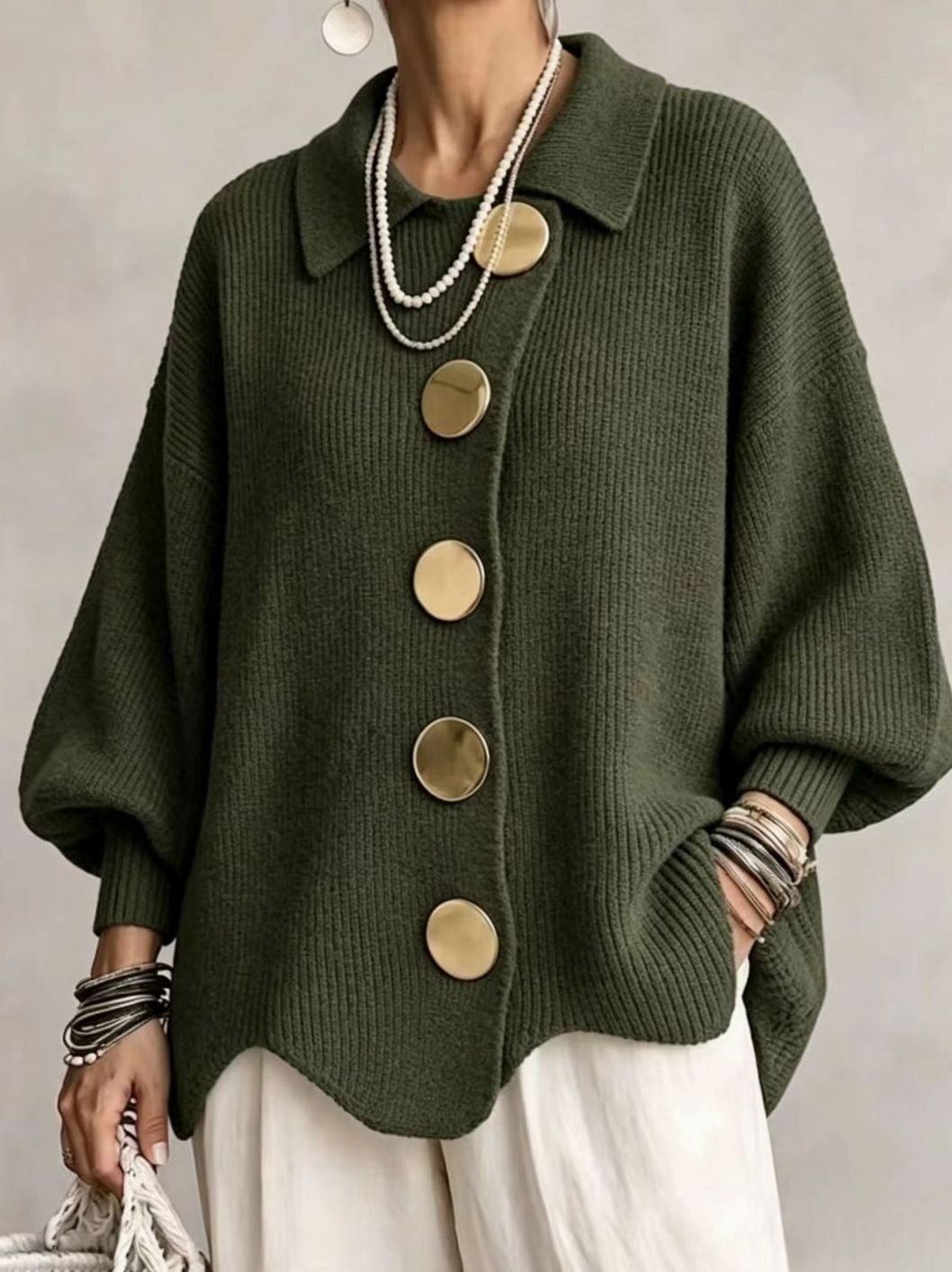Oversized gebreid damesvest met gouden knopen en lantaarnmouwen