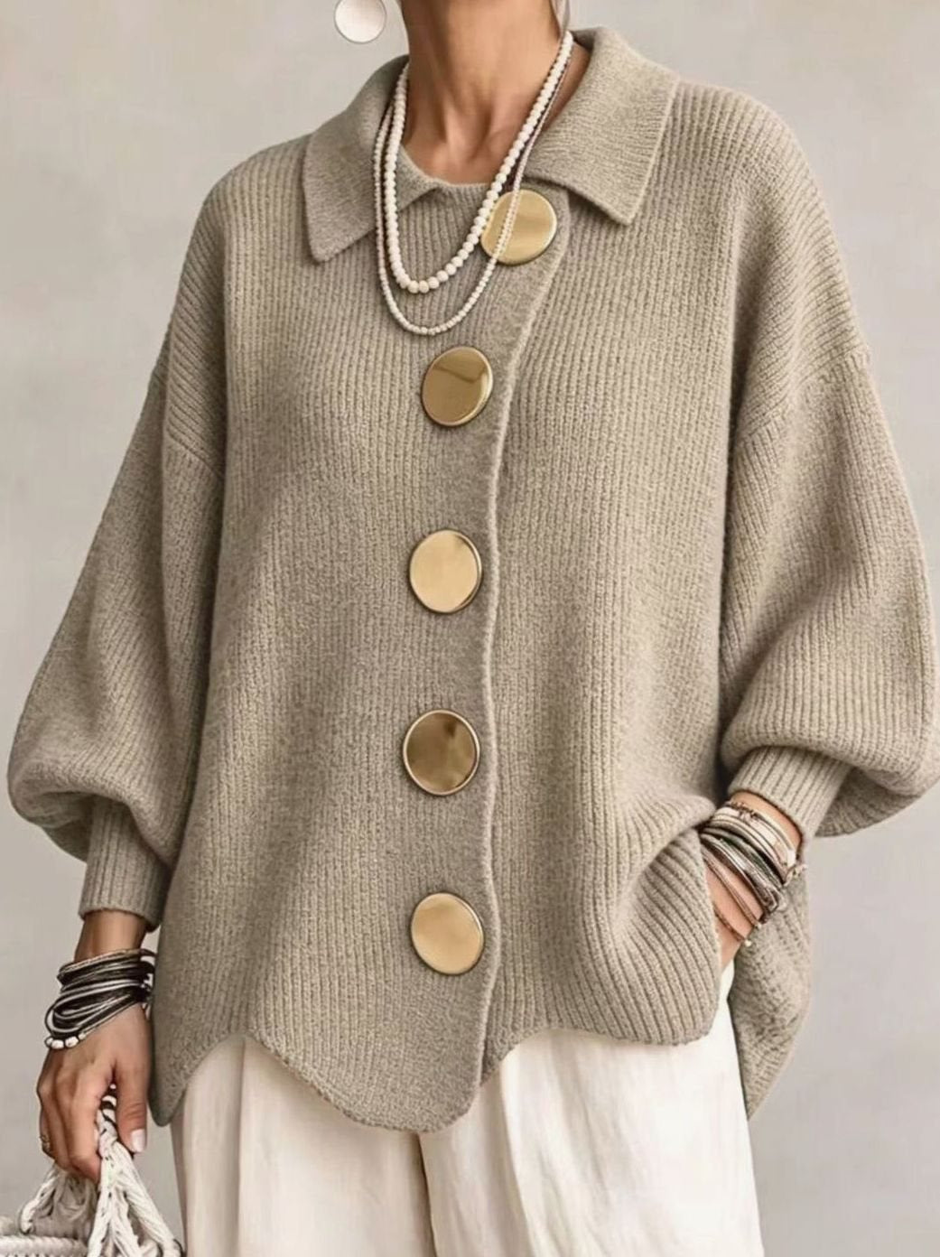 Oversized gebreid damesvest met gouden knopen en lantaarnmouwen